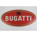 A fine and heavy 20th Century Bugatti-themed cast metal oval wall sign measuring 35 x 17.
