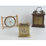 A Smiths eight day floating balance clock, together with a brass Avia Carriage clock,