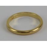 A yellow metal ring, no apparent hallmark, size J, 2g.