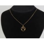 A 9ct gold 'M' pendant,