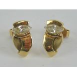 A pair of 9ct gold stud earrings each having marquis shaped cz stone upon,