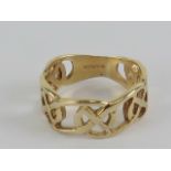 A 9ct gold ring having Celtic cross pattern, hallmarked 375, size Q-R, 4.4g.