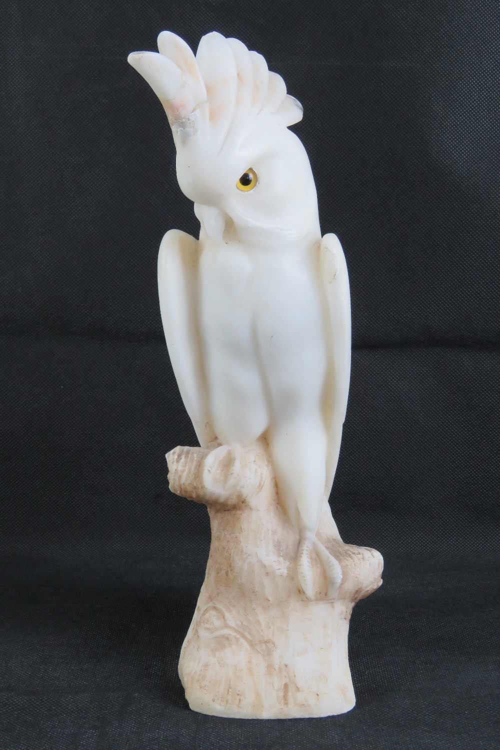 A 19th century carved alabaster cockateal a/f to crest, with glass eyes, 33cm high. - Image 3 of 4