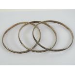 A set of three HM silver bangles, each having London 1976 hallmark and approx 7.5cm dia.