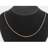 A 9ct gold woven chain necklace measuring 62cm in length, hallmarked London, 10.5g.