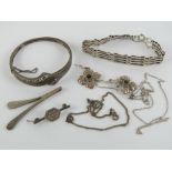 A quantity of silver jewellery including hinged bangle, two chains, gate link bracelet,