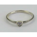 A silver Pandora ring having heart set with white stone to centre, marked S925 ALE 58,