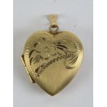 A 9ct gold locket in the form of a heart having partial floral engraving to front, hallmarked 375,