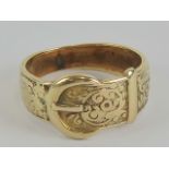 A 9ct gold ring in the form of a belt with buckle having engraved floral pattern to 'belt',