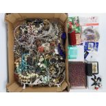 A large quantity of assorted costume jewellery including; rings, glass bead necklaces, bangle,