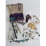 A quantity of assorted jewellery within purple velvet jewellery box includes some single silver