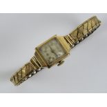 A vintage 9ct gold ladies cocktail watch on expanding rolled gold strap.