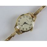 A 9ct gold Rodania ladies wristwatch on 9ct gold expanding bracelet strap, Swiss manual movement,
