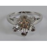 A Clogau silver ring in flower design with central diamond set in Welsh rose gold, hallmarked 925,