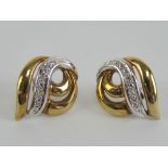 A pair of diamond 9ct white and yellow gold stud earrings, hallmarked 375,