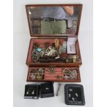 A wooden jewellery box having mirrored lid and lift out tray,