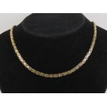 A 9ct gold articulated half hoop and bar chain necklace measuring 42cm in length,