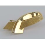 A 9ct gold brooch in the form of a ribbon, 4.5cm in length, 4.9g.