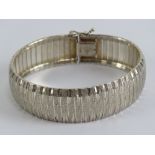 A HM silver articulated panel bracelet,