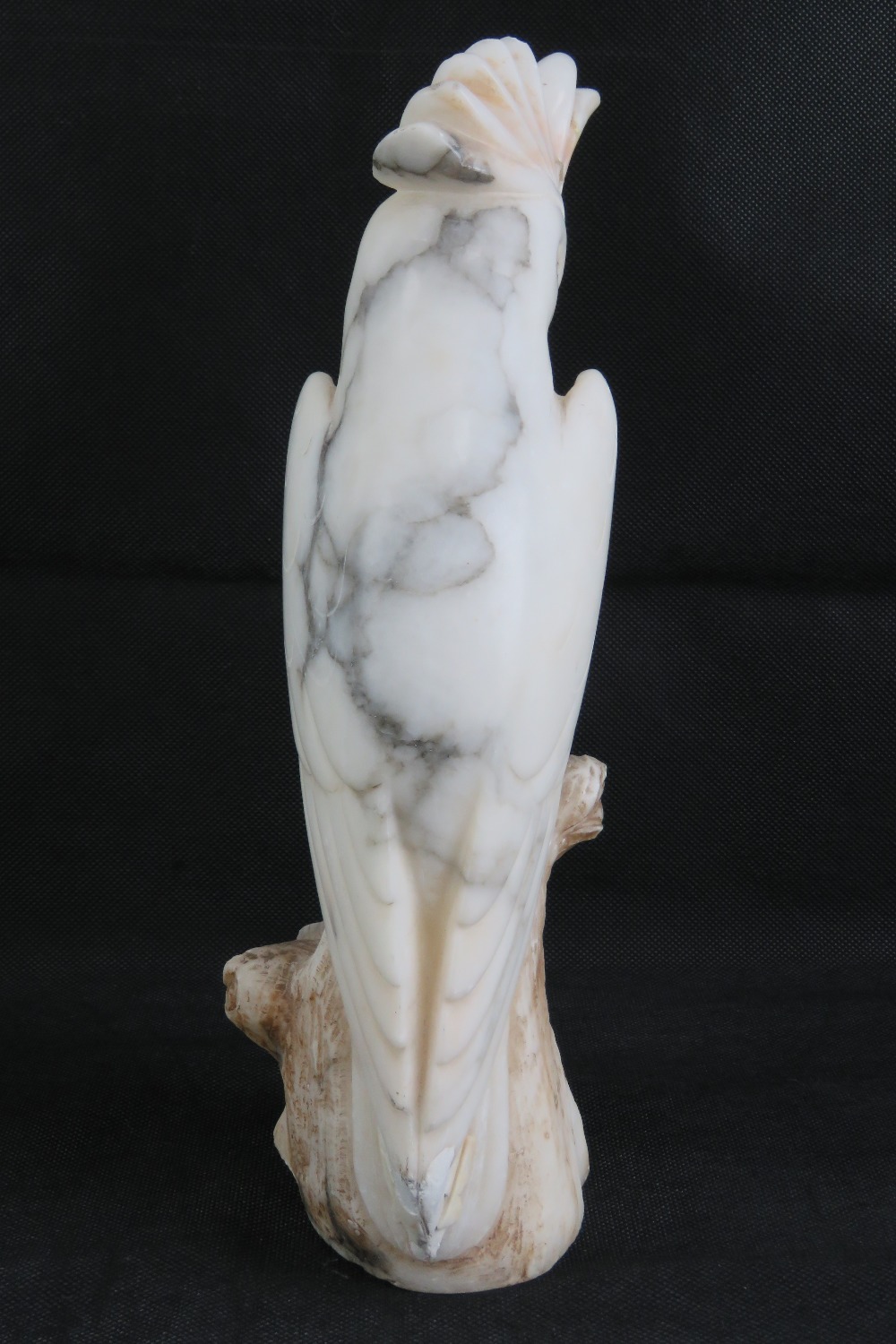 A 19th century carved alabaster cockateal a/f to crest, with glass eyes, 33cm high. - Image 4 of 4