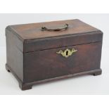 A Georgian mahogany square shaped tea caddy having brass hinged top handle and escutcheon plate,