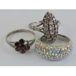 Three silver rings, one marquise shaped set with white stones size Q-R,
