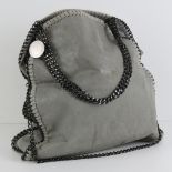 A grey suede ladies handbag with chain detail, 38cm wide.