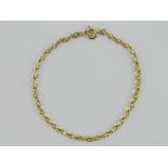 To match above Lot; A 9ct gold faceted oval link chain bracelet measuring 18.
