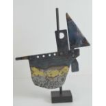 A handmade contemporary sculpture of a sailboat standing 33cm high.