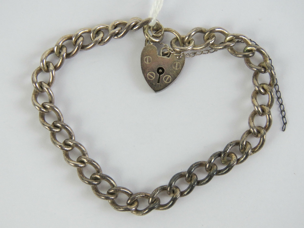 A HM silver charm bracelet having heart padlock clasp, chain hallmarked for Birmingham, 18.