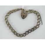 A HM silver charm bracelet having heart padlock clasp, chain hallmarked for Birmingham, 18.