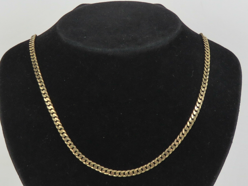 A 9ct gold flattened curb link chain necklace measuring 47.5cm in length, hallmarked 375. 16.3g.