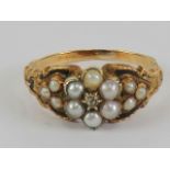 A Victorian diamond pearl and black enamel mourning ring,