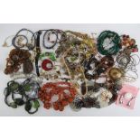 A quantity of assorted costume jewellery inc malachite bead necklace, bangles, shell bracelets,