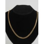 A 9ct gold flattened curb link chain necklace measuring 51cm in length, hallmarked 375. 31.3g.