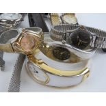 A large quantity of assorted men's and ladies wristwatches.