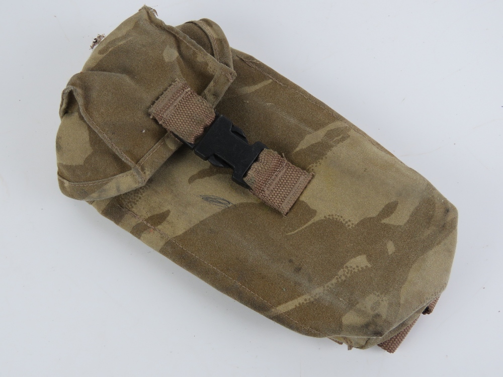 A desert camouflage magazine pocket.