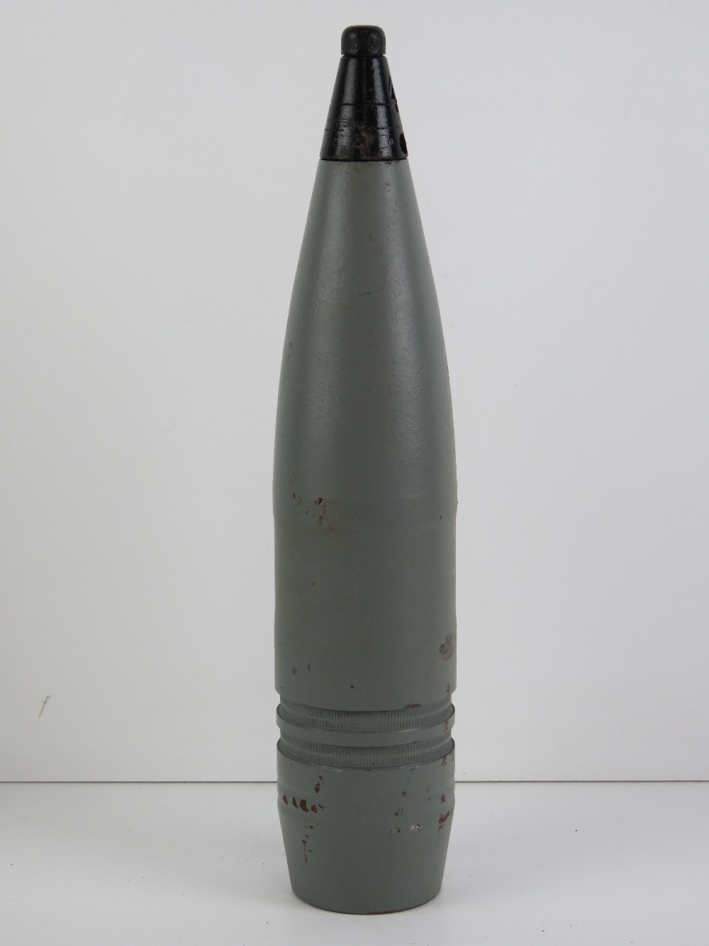 An inert British 76mm shell head with fu