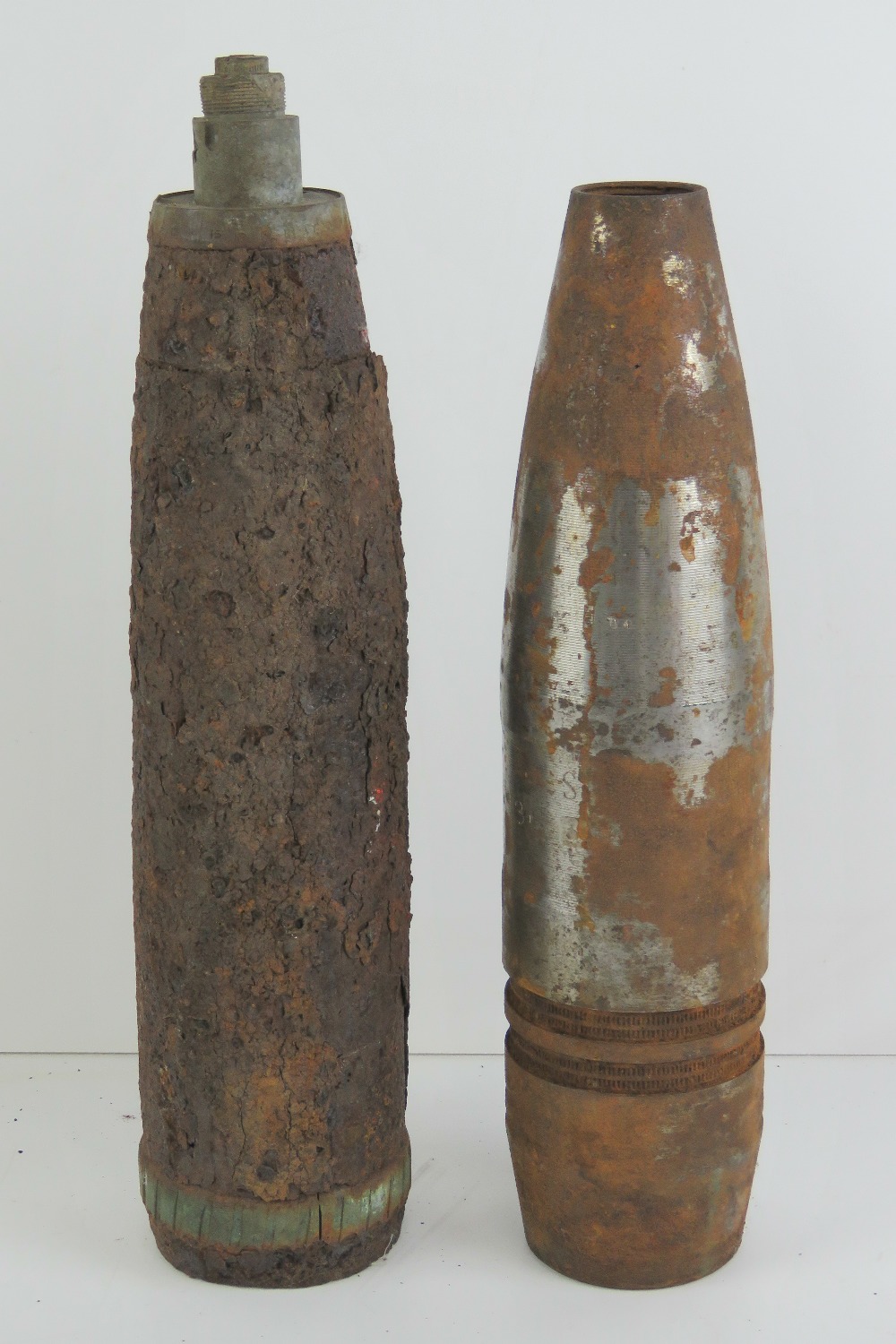 Two inert shells with heads in relic con