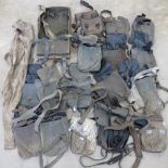 A quantity of assorted AK, M56, and RPG magazine and rocket pouches.