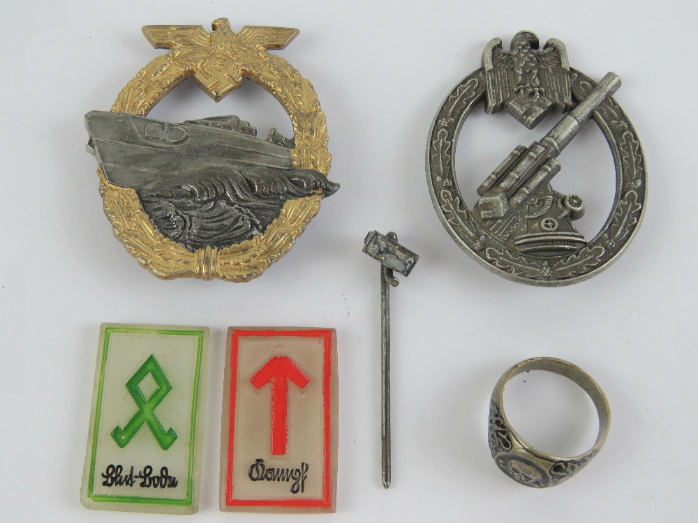 Two reproduction WWII German badges being an Army Flak badge with broken pin,