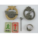Two reproduction WWII German badges being an Army Flak badge with broken pin,