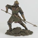 A contemporary figurine of a Japanese Samurai in armour, a/f.