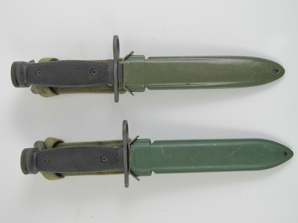 Two Italian Military Issue Beretta SAR70 assault rifle bayonets, each in scabbard.