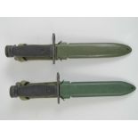 Two Italian Military Issue Beretta SAR70 assault rifle bayonets, each in scabbard.