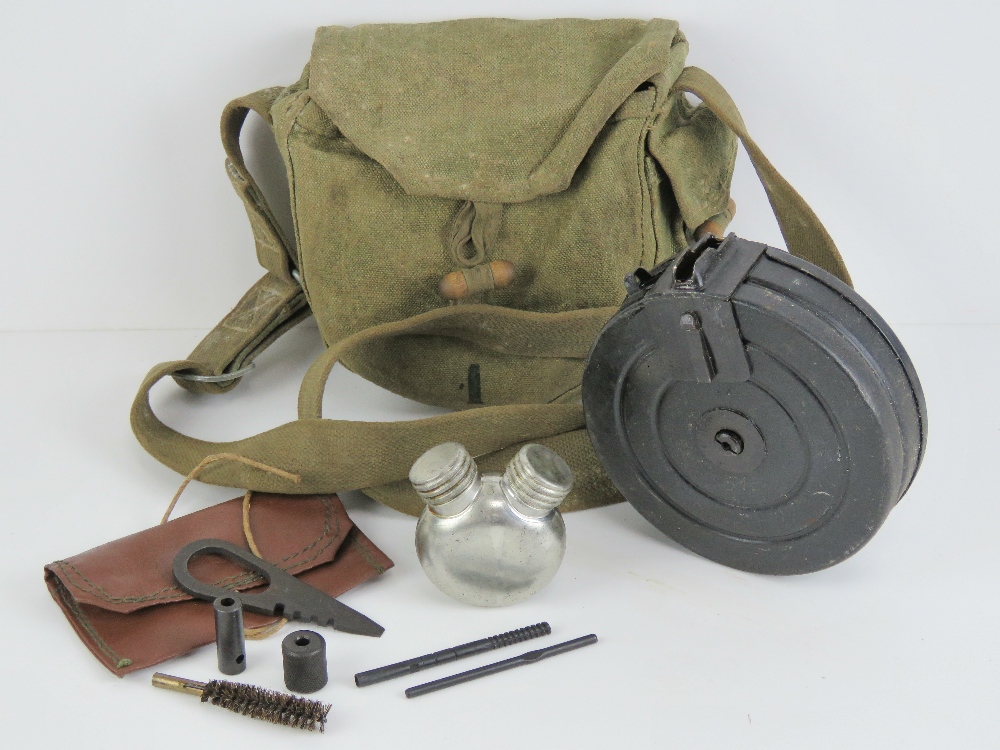 A WWII Russian PPSH-41 drum magazine in carry case, with cleaning kit and oil bottle.