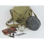 A WWII Russian PPSH-41 drum magazine in carry case, with cleaning kit and oil bottle.