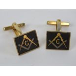 Masonic; A pair of Masonic cuff links having square and compass design upon.