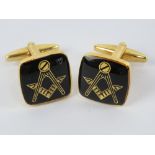 Masonic; A pair of Masonic cuff links having square and compass design upon.