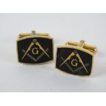 Masonic; A pair of Masonic cuff links having square and compass design upon.